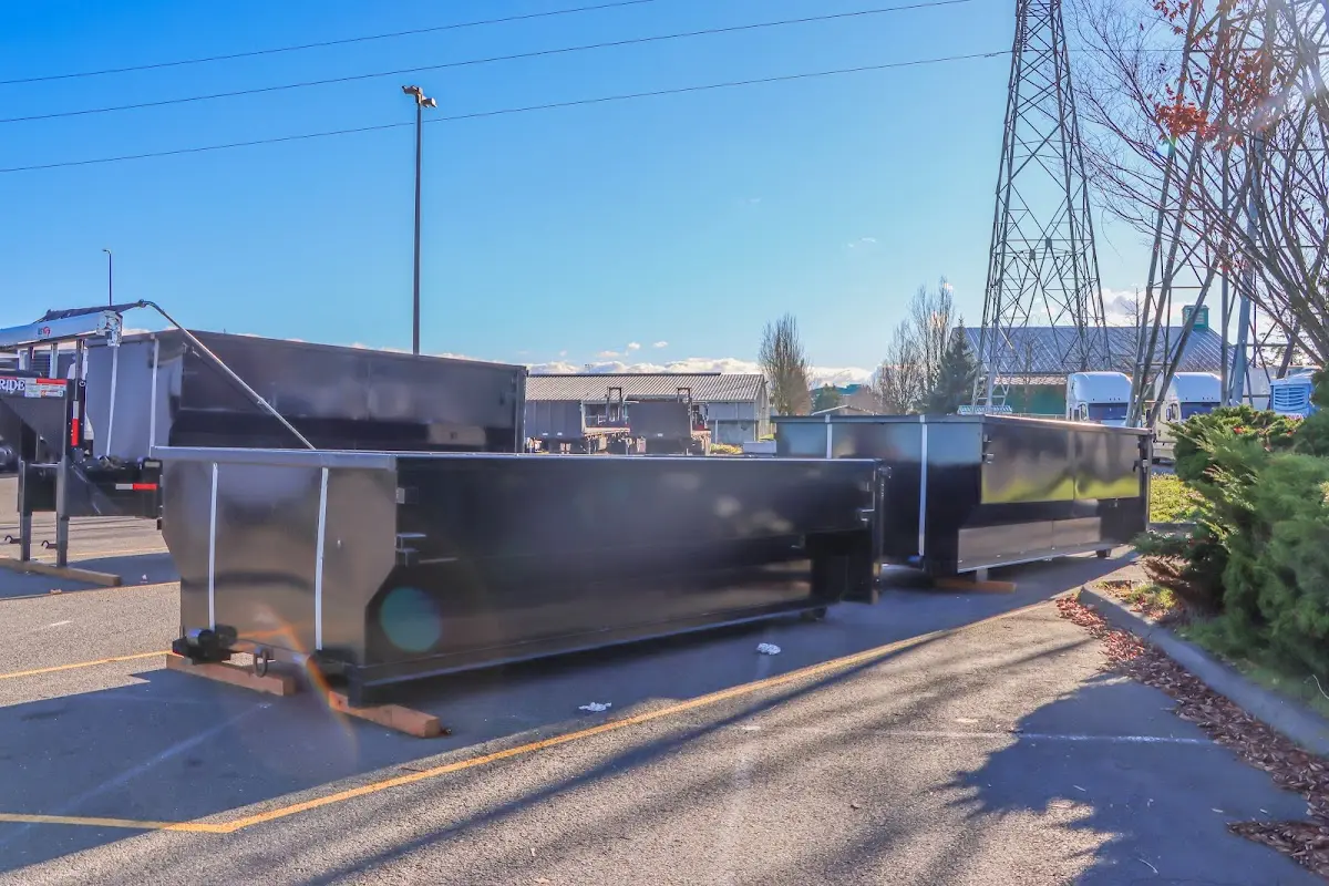 Roll-off dumpster ready for waste disposal at job site for 12 Yard Dumpster Rental in Concord